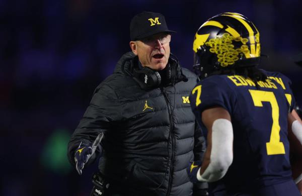 Michigan coach Jim Harbaugh reacts after a second-half touchdown against Purdue on Saturday in Ann Arbor, Mich.