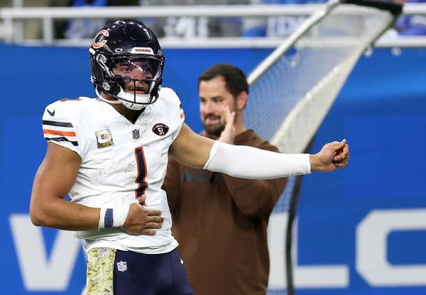 Chicago Bears quarterback Justin Fields celebrates after running for a big first down in the fourth quarter against the Detroit Lions at Ford Field in Detroit on Nov. 19, 2023. 