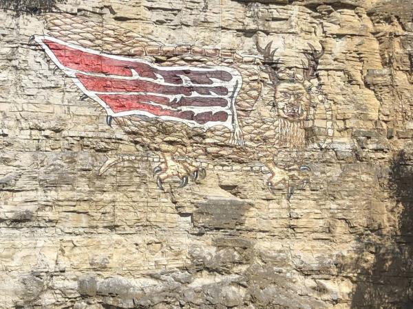 A painting of the Piasa, which translates to "Bird of Evil Spirit" according to writer John W. Allen, occupies a bluff along the Mississippi River in Alton near the site wher<em></em>e ancient petroglyphs depicting a similar creature were quarried away in the 1840s. The first mention of the "river monster" came in a journal written by explorer Jacques Marquette in 1673. 