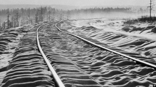 FILE - Snow ripples over railroad ties on the then-new Bailkal-Amur Mainline railway in the far east of Russia in 1978. A Ukrainian source said on Dec. 1, 2023, that its spy agency detonated explosives on the railway line to disrupt military supply routes.