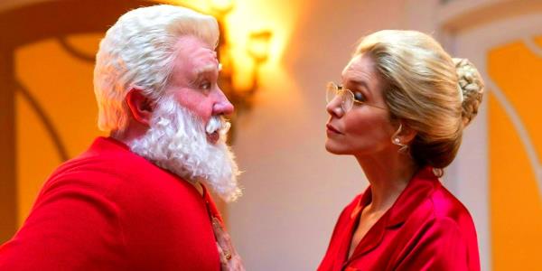Elizabeth Mitchell as Mrs Clause and Tim Allen as Santa Clause facing each other wearing pajamas in The Santa Clauses season 1