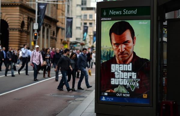 An advertisement for "GTA V" with the character Michael in the back is seen on the road in Sydney on September 17, 2013.