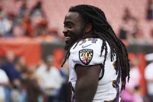 FILE - Baltimore Ravens running back Alex Collins attends during warmups prior to an NFL football game against the Cleveland Browns, Oct. 10, 2018, in Cleveland. Former NFL running back Collins, who played five seasons for the Seattle Seahawks and the Ravens after a terrific college career at Arkansas, has died. He was 28. The Seahawks released a statement from Collins' family that said he died Monday, Aug. 14, 2023. (AP Images/Rick Osentoski, File)