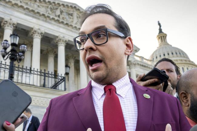 FILE - Rep. George Santos, R-N.Y., speaks to reporters outside the Capitol, in Washington, May 17, 2023. Sam Miele, a former political fundraiser for Santos, was indicted on federal charges Wednesday for allegedly imperso<em></em>nating a high-ranking co<em></em>ngressional aide while soliciting co<em></em>ntributions for the embattled Republican’s campaign. (AP Photo/J. Scott Applewhite, File)