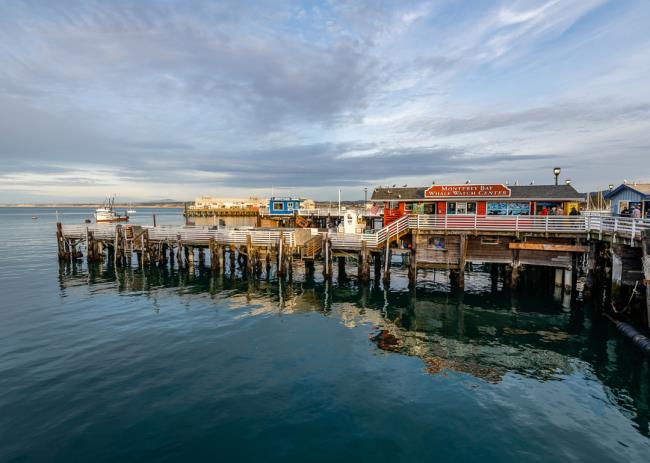 Artist Mario Uribe and grandson, Jayden DeSadeleer, 7, both of Santa Rosa, inspects a mailbox art piece offered for sale during the Artists for Artstart benefit outside the Artstart studio in Santa Rosa, Sunday, Aug. 13, 2023. (Darryl Bush / For The Press Democrat)