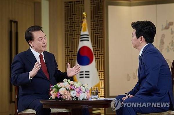 President Yoon Suk Yeol (L) speaks during a special interview with state-run broadcaster KBS at the presidential office in Seoul on Feb. 4, 2024, in this photo provided by the office. (PHOTO NOT FOR SALE) (Yonhap)