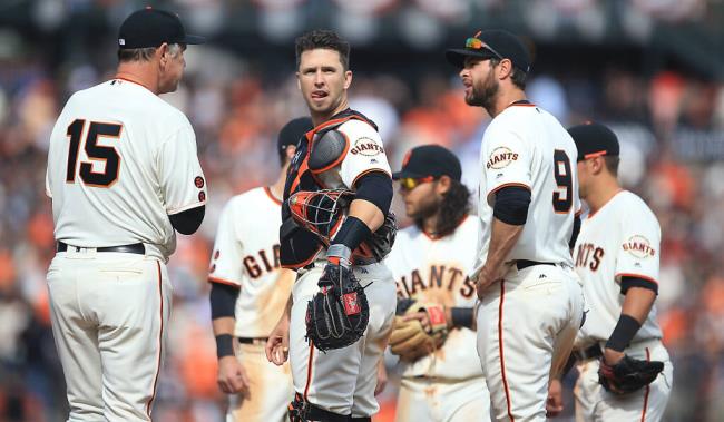 Buster Posey co<em></em>ntemplates a Giants pitching change during the Giants home opener against the Dodgers at AT&T Park in San Francisco, Thursday April April 7, 2016. (Kent Porter / Press Democrat ) 2016