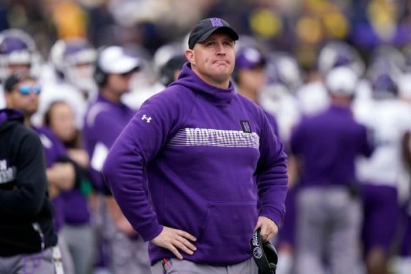 Northwestern head coach Pat Fitzgerald stands on the sideline on Oct. 23, 2021,, in Ann Arbor, Mich.