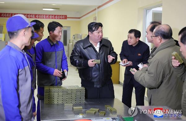 North Korean leader Kim Jong-un (C) visits a factory in Kimwha County in the North's Kangwon Province on Feb. 7, 2024, in this photo released by the Korean Central News Agency the following day. (For Use o<em></em>nly in the Republic of Korea. No Redistribution) (Yonhap)