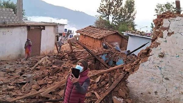 Thousands sleep outside in Nepal after earthquake kills at least 157 people