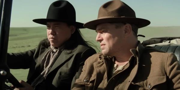 Leo<em></em>nardo DiCaprio as Ernest Burkhart riding in a car in Killers of the Flower Moon