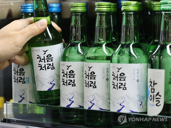This Dec. 27, 2023, file photo shows bottles of soju at a Seoul supermarket. (Yonhap)