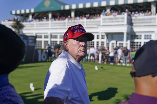 Former President Do<em></em>nald Trump looks over the crowd during the final round of the Bedminster Invitatio<em></em>nal LIV Golf tournament in Bedminster, N.J., Sunday, Aug. 13, 2023. (AP Photo/Seth Wenig)