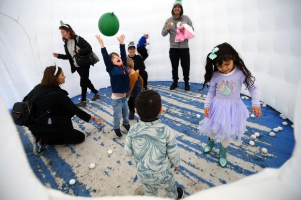 Alina Calloway enjoys the balloon drop with her family during...