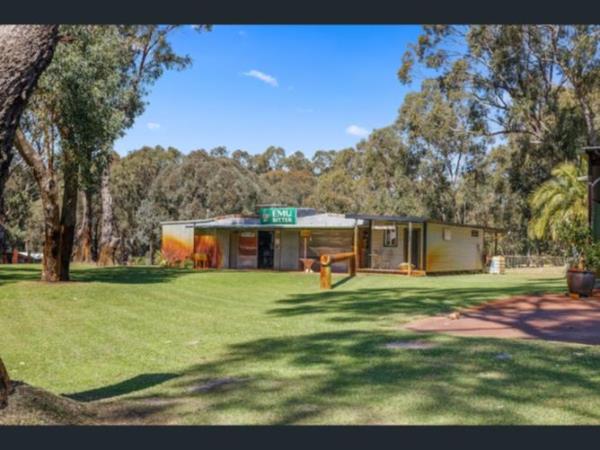 While the four-bedroom home on Wanneroo Road is stunning in its own right, the drawcard on the 10-acre property is a 230sqm man cave with an old-school bush pub.