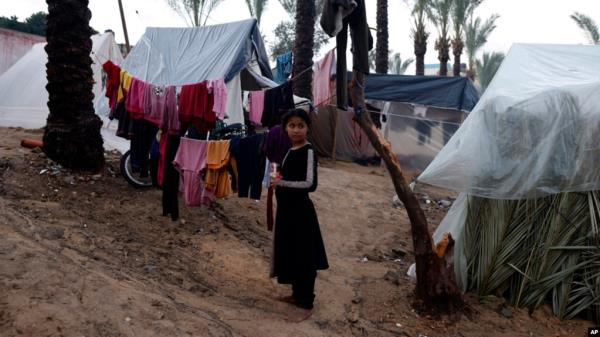 Palestinians displaced by the Israeli bombardment of the Gaza Strip are seen in tents in town of Khan Younis, Dec. 13, 2023.
