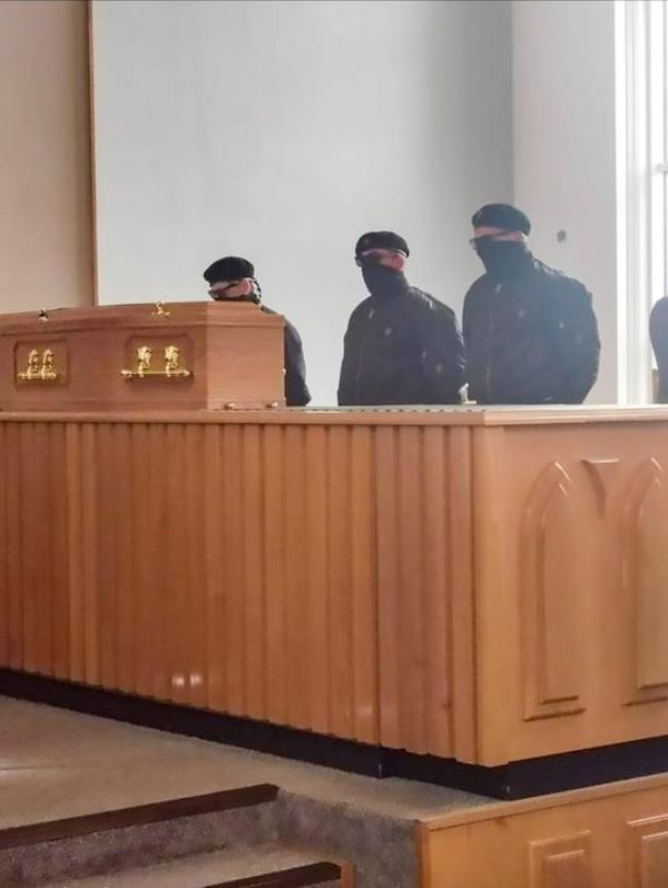 Three masked UDA men in Roselawn Crematorium