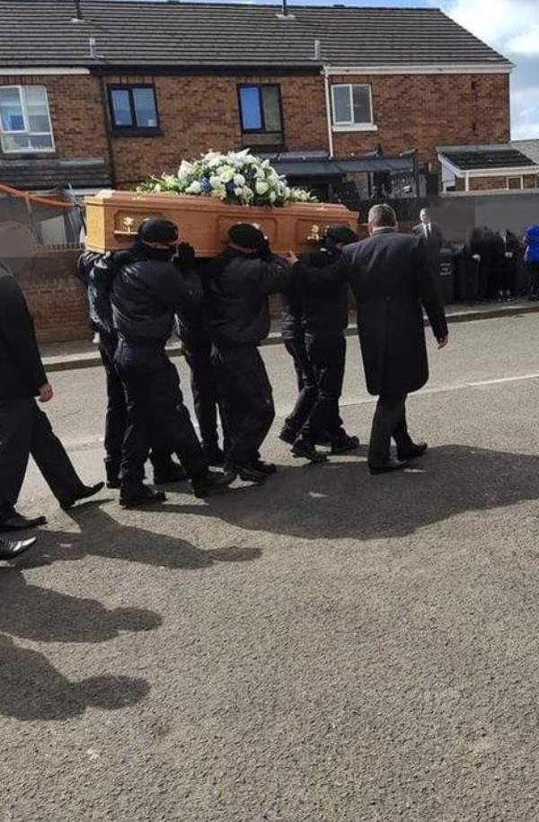 UDA men carry Best's coffin in Tiger's Bay