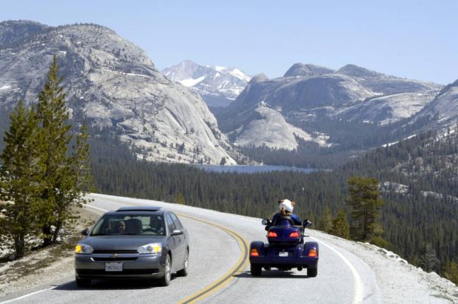 Tourists drive along highway 120 (Tioga Road) at Olmsted Point in Yosemite, Calif., Friday, June 24, 2005. (AP Photo/Al Golub)