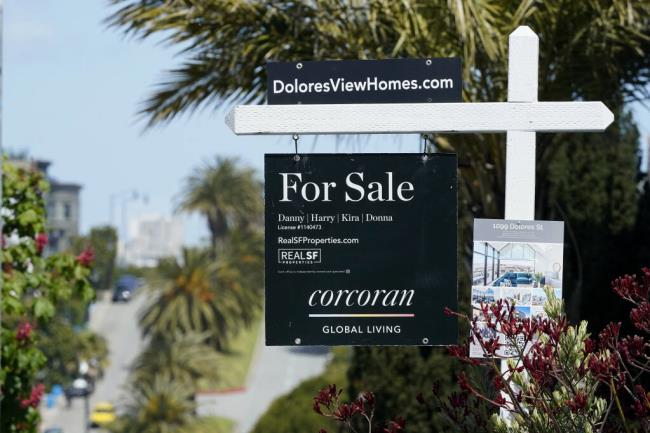 A For Sale sign hangs in front of a property in San Francisco, Tuesday, April 18, 2023. (AP Photo/Jeff Chiu)