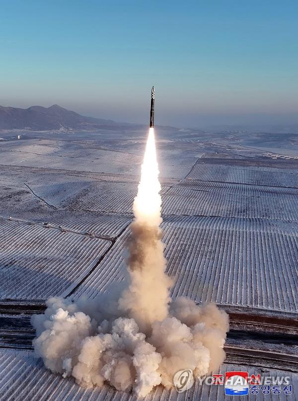 North Korea fires a Hwasong-18 solid-fuel interco<em></em>ntinental ballistic missile (ICBM) on Dec. 18, 2023, with its leader Kim Jong-un observing the launch, in this photo released by the North's official Korean Central News Agency the following day. (For Use o<em></em>nly in the Republic of Korea. No Redistribution) (Yonhap)