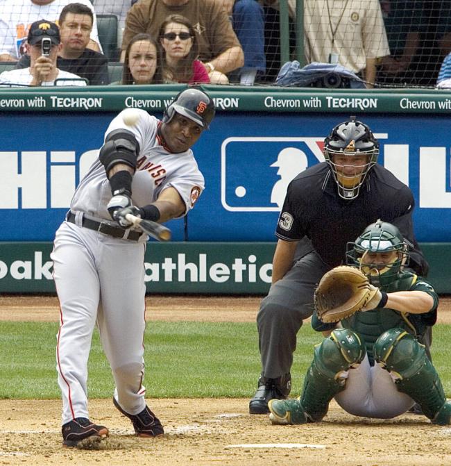 The Giants' Barry Bo<em></em>nds hits his 714th career home run a solo shot off Oakland Athletics pitcher Brad Halsey during the second inning in May 2006. Columnist Bob Padecky felt comfortable around the surly Bonds, and o<em></em>nce asked him why he was such a jerk, with jerk substituted for another word. Bo<em></em>nds gave a poignant answer. (AP Photo/Ben Margot, File)