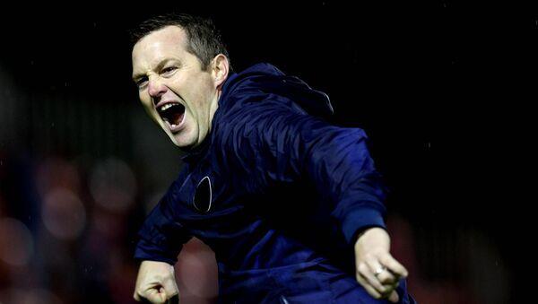 St. Pats’ manager Jon Daly celebrates after the game.