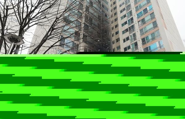 This photo, taken Dec. 25, 2023, shows an apartment building in Seoul's Dobong district charred by a fire that broke out in the wee hours of Christmas Day. (Yonhap)
