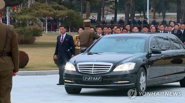 This photo, taken from footage aired by the North's Korean Central Television on Dec. 27, 2023, shows Premier Kim Tok-hun (L) arriving for a year-end plenary meeting of the Central Committee of the North's ruling Workers' Party in Pyo<em></em>ngyang the previous day in a Mercedes-Benz vehicle. (For Use o<em></em>nly in the Republic of Korea. No Redistribution) (Yonhap)