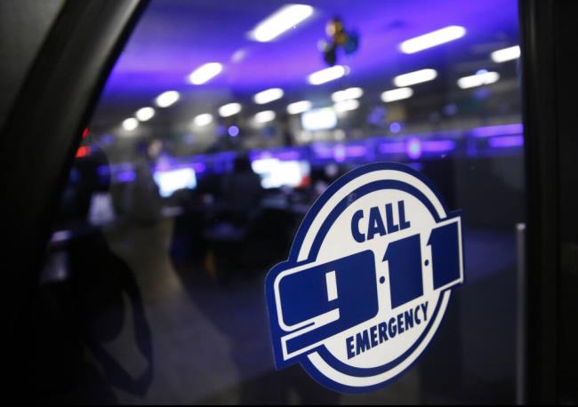 FILE - A police 911 call center is pictured on May 3, 2019, in Dallas. Emergency call center workers say their centers are understaffed, struggling to hire new staff and plagued by worker burnout, according to a natio<em></em>nal survey released Tuesday, July 25, 2023. (Rose Baca/The Dallas Morning News via AP, File)