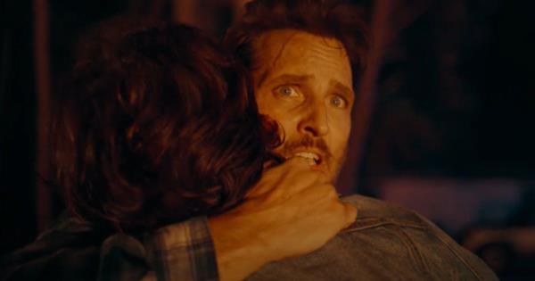 Peter Facinelli hugs someone in On Fire