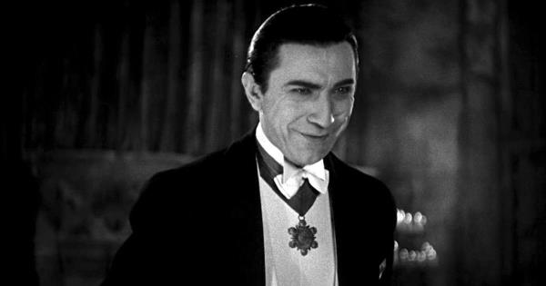 Bela Lugosi as Count Dracula wearing his fancy suit and slicked back hair.
