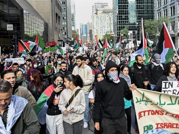 People take part in a pro-Palestine rally in Mo<em></em>ntreal on Sunday, Oct. 8, 2023. Hamas militants led a surprise attack on Israel from the Gaza Strip on Saturday, leading to hundreds of casualties and retaliation strikes by Israel.